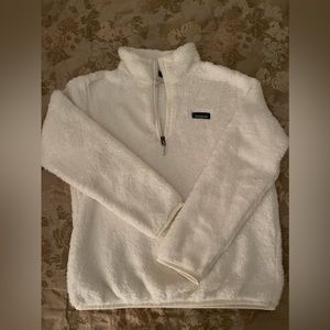 Woman’s white fuzzy Patagonia quarter zip fleece